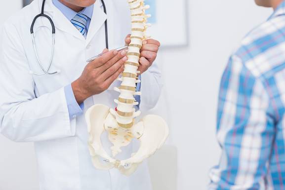 doctor talking to a patient about spine