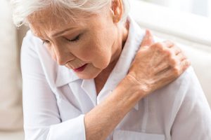 older woman upper back pain