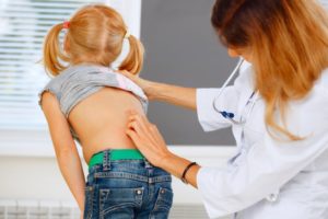child being evaluated for scoliosis in Richardson