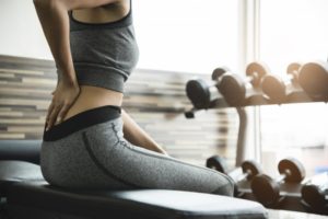 woman who is exercising with a herniated disc