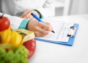 dietitian working on a case for a patient