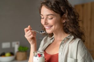 woman eating yogurt for calcium
