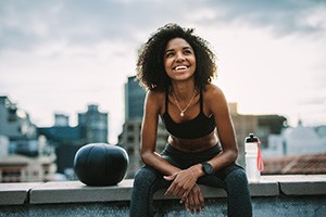 smiling active person sitting down